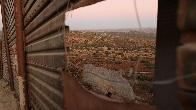 Border Fence Peek.jpg
